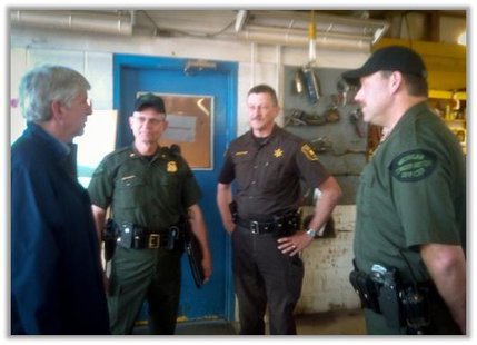 The Governor gets a briefing before flying over the fire and the scorched earth it is leaving behind. The Governor gets a briefing before flying over the fire and the scorched earth it is leaving behind.