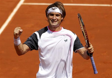 David Ferrer of Spain reacts after winning his match against Mikhail Youzhny of Russia during the French Open tennis tournament at the Rolan David Ferrer of Spain reacts after winning his match against Mikhail Youzhny of Russia during the French Open tennis tournament at the Rolan