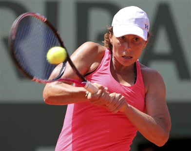 Varvara Lepchenko of the U.S. returns the ball to Francesca Schiavone of Italy during the French Open tennis tournament at the Roland Garros Varvara Lepchenko of the U.S. returns the ball to Francesca Schiavone of Italy during the French Open tennis tournament at the Roland Garros