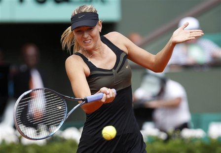 Maria Sharapova of Russia returns the ball to Peng Shuai of China during the French Open tennis tournament at the Roland Garros stadium in P Maria Sharapova of Russia returns the ball to Peng Shuai of China during the French Open tennis tournament at the Roland Garros stadium in P