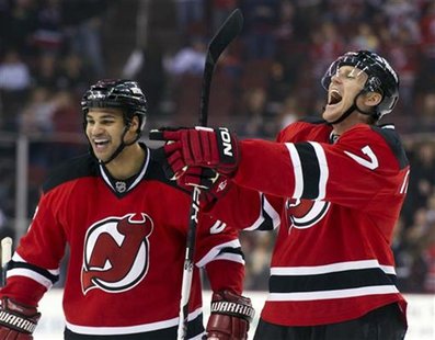 New Jersey Devils defenseman Henrik Tallinder (R) celebrates with defenseman Mark Fraser (2) after scoring against the Toronto Maple Leafs i New Jersey Devils defenseman Henrik Tallinder (R) celebrates with defenseman Mark Fraser (2) after scoring against the Toronto Maple Leafs i
