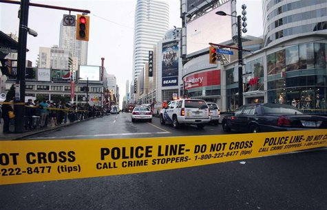 Police tape is seen in front of the Toronto Eaton Centre shopping mall in Toronto June 2, 2012. REUTERS/Mark Blinch Police tape is seen in front of the Toronto Eaton Centre shopping mall in Toronto June 2, 2012. REUTERS/Mark Blinch