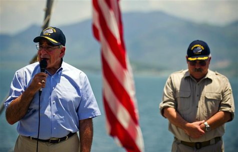 U.S. Defense Secretary Leon Panetta (L) speaks to the crew next to United States Navy ship (USNS) Richard E. Byrd Master Captain John Sargen U.S. Defense Secretary Leon Panetta (L) speaks to the crew next to United States Navy ship (USNS) Richard E. Byrd Master Captain John Sargen