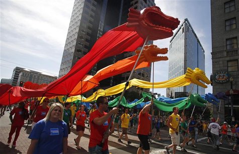 Participants march with rainbow-colored dragons in a gay pride parade in Salt Lake City, Utah, June 3, 2012. Over 300 active Mormons and mor Participants march with rainbow-colored dragons in a gay pride parade in Salt Lake City, Utah, June 3, 2012. Over 300 active Mormons and mor
