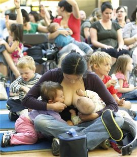 A woman breastfeeds her babies during the Defi Allaitement (Breastfeeding Challenge) in Quebec City, September 24, 2011. REUTERS/Mathieu Bel A woman breastfeeds her babies during the Defi Allaitement (Breastfeeding Challenge) in Quebec City, September 24, 2011. REUTERS/Mathieu Bel