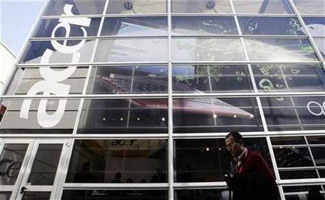 A man walks past an 'Acer' office during the Mobile World Congress in Barcelona in this February 18, 2010 file photo. REUTERS/Albert Gea/Fil A man walks past an 'Acer' office during the Mobile World Congress in Barcelona in this February 18, 2010 file photo. REUTERS/Albert Gea/Fil