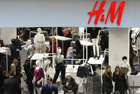People shop in the newly opened Hennes & Mauritz (H&M) store in Moscow, March 13, 2009. REUTERS/Denis Sinyakov People shop in the newly opened Hennes & Mauritz (H&M) store in Moscow, March 13, 2009. REUTERS/Denis Sinyakov