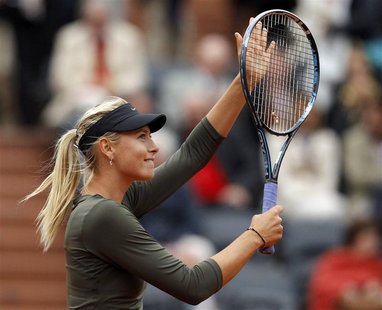 Maria Sharapova of Russia celebrates after winning her match against Klara Zakopalova of the Czech Republic during the French Open tennis to Maria Sharapova of Russia celebrates after winning her match against Klara Zakopalova of the Czech Republic during the French Open tennis to