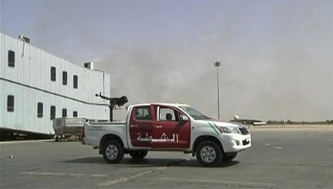 A vehicle mounted with an anti-aircraft gun is seen on the tarmac at Tripoli's international airport in this still image taken from video Ju A vehicle mounted with an anti-aircraft gun is seen on the tarmac at Tripoli's international airport in this still image taken from video Ju