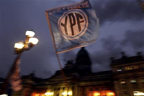 A flag with the YPF logo is waved in front of the Argentine Congress in Buenos Aires, April 25, 2012. REUTERS/Marcos Brindicci A flag with the YPF logo is waved in front of the Argentine Congress in Buenos Aires, April 25, 2012. REUTERS/Marcos Brindicci