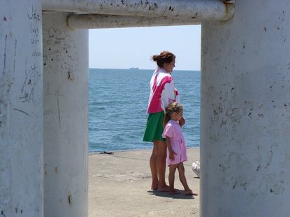 Visitors to the pier at Holland State Park watch the SS Keewatin sail by on Monday, June 4. Visitors to the pier at Holland State Park watch the SS Keewatin sail by on Monday, June 4.