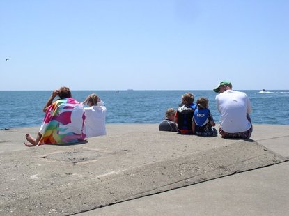 Visitors to the pier at Holland State Park watch the SS Keewatin sail past on Monday, June 4. Visitors to the pier at Holland State Park watch the SS Keewatin sail past on Monday, June 4.