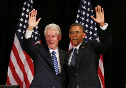 Former U.S. President Bill Clinton (L) and U.S. President Barack Obama wave at a fundraiser, at the Waldorf Astoria in New York June 4, 2012 Former U.S. President Bill Clinton (L) and U.S. President Barack Obama wave at a fundraiser, at the Waldorf Astoria in New York June 4, 2012