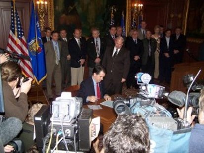 Governor Scott Walker at the signing ceremony for Act 10 (Photo: Wisconsin Radio Network) Governor Scott Walker at the signing ceremony for Act 10 (Photo: Wisconsin Radio Network)