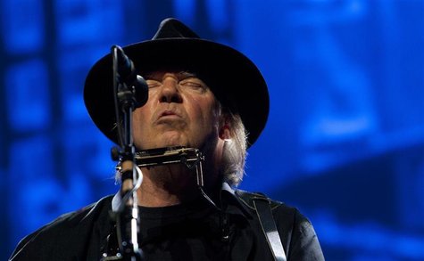 Neil Young performs as a surprise guest musician at the Robin Hood Foundation Benefit at the Jacob K Javits Convention Center in New York Ma Neil Young performs as a surprise guest musician at the Robin Hood Foundation Benefit at the Jacob K Javits Convention Center in New York Ma