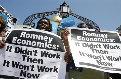 Supporters of President Barack Obama hold signs outside the Massachusetts State House before the start of a news conference in Boston, Massa Supporters of President Barack Obama hold signs outside the Massachusetts State House before the start of a news conference in Boston, Massa