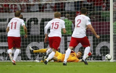 Poland's goalkeeper Przemyslaw Tyton (C) saves a penalty kick of Greece's Giorgos Karagounis (not seen) during their Group A Euro 2012 socce Poland's goalkeeper Przemyslaw Tyton (C) saves a penalty kick of Greece's Giorgos Karagounis (not seen) during their Group A Euro 2012 socce