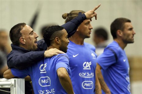 French soccer players (L-R) Franck Ribery, Gael Clichy, Philippe Mexes and Anthony Reveillere attend a training session during the Euro 2012 French soccer players (L-R) Franck Ribery, Gael Clichy, Philippe Mexes and Anthony Reveillere attend a training session during the Euro 2012