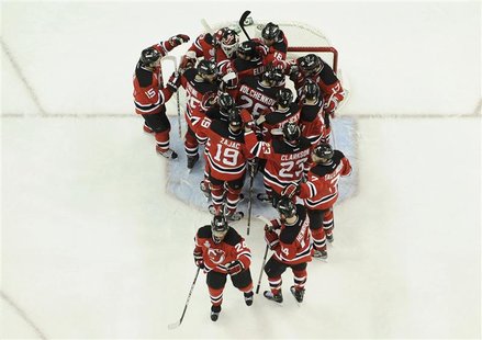 The New Jersey Devils celebrate after defeating the Los Angeles Kings in Game 5 of the NHL Stanley Cup hockey final in Newark, New Jersey, J The New Jersey Devils celebrate after defeating the Los Angeles Kings in Game 5 of the NHL Stanley Cup hockey final in Newark, New Jersey, J