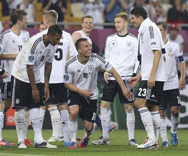 Germany's players celebrate victory against Portugal at the and of their Group B Euro 2012 soccer match in Lviv, June 9, 2012. REUTERS/Thoma Germany's players celebrate victory against Portugal at the and of their Group B Euro 2012 soccer match in Lviv, June 9, 2012. REUTERS/Thoma