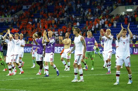 Denmark's players celebrate winning their Group B Euro 2012 soccer match against Netherlands in Kharkiv June 9, 2012. REUTERS/Felix Ordonez Denmark's players celebrate winning their Group B Euro 2012 soccer match against Netherlands in Kharkiv June 9, 2012. REUTERS/Felix Ordonez