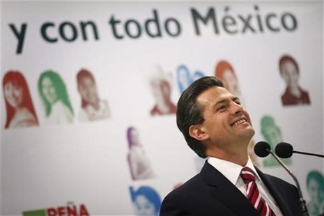 Enrique Pena Nieto, presidential candidate for the opposition Institutional Revolutionary Party (PRI), smiles during a news conference in Me Enrique Pena Nieto, presidential candidate for the opposition Institutional Revolutionary Party (PRI), smiles during a news conference in Me