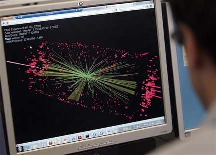 A technician looks at collision at the CMS experiment in the control room of the Large Hadron Collider (LHC) at the European Organisation fo A technician looks at collision at the CMS experiment in the control room of the Large Hadron Collider (LHC) at the European Organisation fo