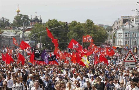 Participants march with flags and placards during an anti-government protest in Moscow June 12, 2012. REUTERS/Denis Sinyakov Participants march with flags and placards during an anti-government protest in Moscow June 12, 2012. REUTERS/Denis Sinyakov
