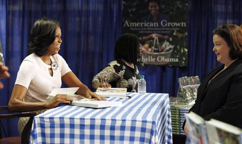 U.S. first lady Michelle Obama attends a book signing of her first book "American Grown" at a book store in Washington, June 12, 2012. REUTE U.S. first lady Michelle Obama attends a book signing of her first book "American Grown" at a book store in Washington, June 12, 2012. REUTE