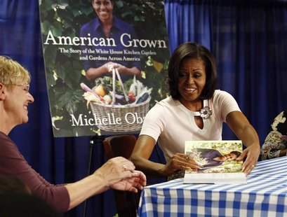 U.S. first lady Michelle Obama attends a book signing of her first book "American Grown" at a book store in Washington, June 12, 2012. REUTE U.S. first lady Michelle Obama attends a book signing of her first book "American Grown" at a book store in Washington, June 12, 2012. REUTE