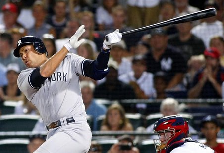 New York Yankees Alex Rodriguez hits a grand slam to tie the game in the eighth inning of play against the Atlanta Braves at their MLB Inter New York Yankees Alex Rodriguez hits a grand slam to tie the game in the eighth inning of play against the Atlanta Braves at their MLB Inter