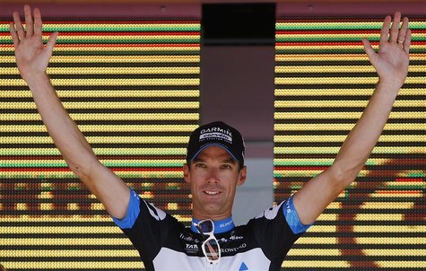 Cervelo's rider David Millar of Britain celebrates on the podium after winning the 26km (16 miles) time trial in the 21st and last stage of Cervelo's rider David Millar of Britain celebrates on the podium after winning the 26km (16 miles) time trial in the 21st and last stage of