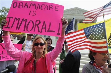 Opponents of Obama health care legislation rally on the sidewalk during the third and final day of legal arguments over the Patient Protecti Opponents of Obama health care legislation rally on the sidewalk during the third and final day of legal arguments over the Patient Protecti