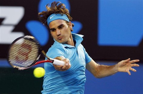 Roger Federer of Switzerland hits a return against France's Jo-Wilfried Tsonga during their semi-final match at the Australian Open tennis t Roger Federer of Switzerland hits a return against France's Jo-Wilfried Tsonga during their semi-final match at the Australian Open tennis t