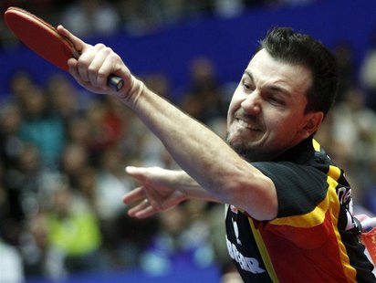 Timo Boll of Germany hits a forehand towards Zhang Jike of China in the men's final at the World Team Table Tennis Championships in Dortmund Timo Boll of Germany hits a forehand towards Zhang Jike of China in the men's final at the World Team Table Tennis Championships in Dortmund