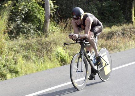 Lance Armstrong of the U.S. cycles during the Ironman Panama 70.3 triathlon in Panama City February 12, 2012. REUTERS/Alberto Muschette Lance Armstrong of the U.S. cycles during the Ironman Panama 70.3 triathlon in Panama City February 12, 2012. REUTERS/Alberto Muschette