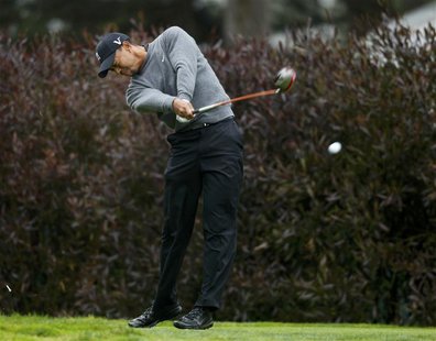 Tiger Woods of the U.S. tees off on the 17th hole during a practice round for the 2012 U.S. Open golf tournament on the Lake Course at the O Tiger Woods of the U.S. tees off on the 17th hole during a practice round for the 2012 U.S. Open golf tournament on the Lake Course at the O