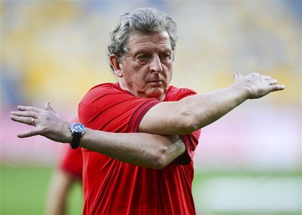 England's national soccer coach Roy Hodgson stretches during a training session ahead of their Euro 2012 soccer match against Sweden at the England's national soccer coach Roy Hodgson stretches during a training session ahead of their Euro 2012 soccer match against Sweden at the