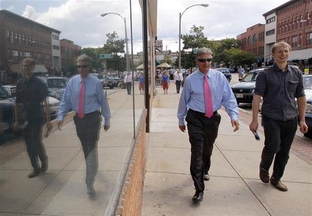 Republican presidential candidate and former New Mexico Governor Gary Johnson (C) walks through downtown Concord, New Hampshire August 23, 2 Republican presidential candidate and former New Mexico Governor Gary Johnson (C) walks through downtown Concord, New Hampshire August 23, 2