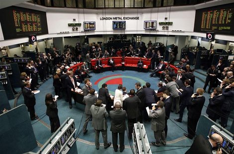 Traders and clerks react on the floor of the London Metal Exchange in the City of London, in this file picture taken February 14, 2012. The Traders and clerks react on the floor of the London Metal Exchange in the City of London, in this file picture taken February 14, 2012. The