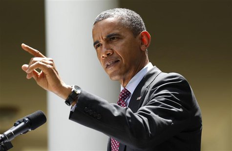 U.S. President Barack Obama responds to a reporter interrupting his comments on immigration in the Rose Garden of the White House in Washing U.S. President Barack Obama responds to a reporter interrupting his comments on immigration in the Rose Garden of the White House in Washing
