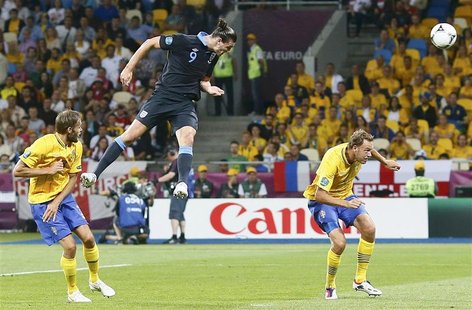 England's Andy Carroll scores his team's first goal against Sweden during their Group D Euro 2012 soccer match at the Olympic stadium in Kie England's Andy Carroll scores his team's first goal against Sweden during their Group D Euro 2012 soccer match at the Olympic stadium in Kie
