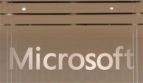The Microsoft logo hangs from a window during the grand opening of Microsoft's first retail store in Scottsdale, Arizona October 22, 2009. R The Microsoft logo hangs from a window during the grand opening of Microsoft's first retail store in Scottsdale, Arizona October 22, 2009. R