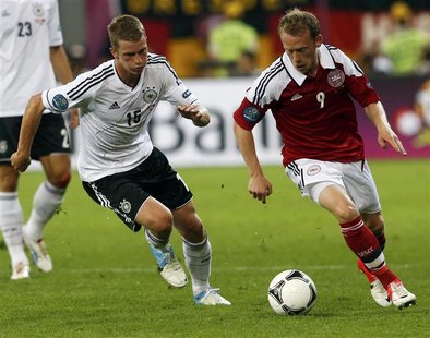 Denmark's Michael Krohn-Dehli (R) challenges Germany's Lars Bender during their Euro 2012 Group B soccer match at the New Lviv stadium in Lv Denmark's Michael Krohn-Dehli (R) challenges Germany's Lars Bender during their Euro 2012 Group B soccer match at the New Lviv stadium in Lv
