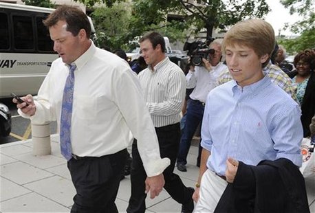 Former MLB baseball pitcher Roger Clemens (L) departs the courthouse with family members and his defense team after the end of closing argum Former MLB baseball pitcher Roger Clemens (L) departs the courthouse with family members and his defense team after the end of closing argum