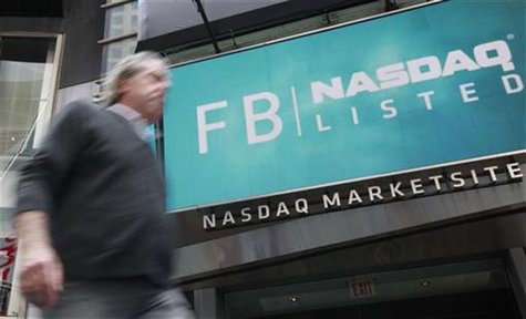 A man walks past a sign welcoming Facebook to the NASDAQ Marketsite in New York May 18, 2012.REUTERS/Brendan McDermid A man walks past a sign welcoming Facebook to the NASDAQ Marketsite in New York May 18, 2012.REUTERS/Brendan McDermid