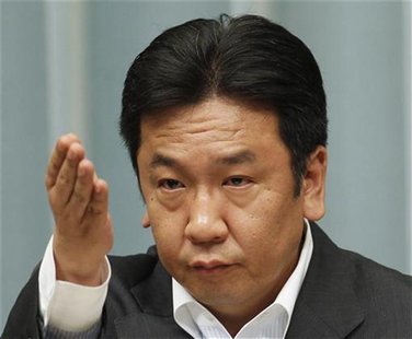 Japan's Trade Minister Yukio Edano points to a journalist, as he listens to questions raised during a news conference about the resumption o Japan's Trade Minister Yukio Edano points to a journalist, as he listens to questions raised during a news conference about the resumption o