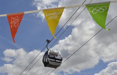 A gondola passes above London 2012 Olympic Games bunting as it departs from at a station in Royal Docks in east London June 17, 2012. REUTER A gondola passes above London 2012 Olympic Games bunting as it departs from at a station in Royal Docks in east London June 17, 2012. REUTER