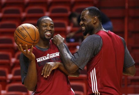 Miami Heat's Dwyane Wade (L) and LeBron James (R) joke around during a team practice for the NBA basketball finals in Miami June 18, 2012. H Miami Heat's Dwyane Wade (L) and LeBron James (R) joke around during a team practice for the NBA basketball finals in Miami June 18, 2012. H