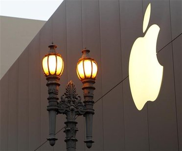 The Apple logo is shown prior to the initial sales of the new iPhone 4S at Apple's flagship retail store in San Francisco, California Octobe The Apple logo is shown prior to the initial sales of the new iPhone 4S at Apple's flagship retail store in San Francisco, California Octobe